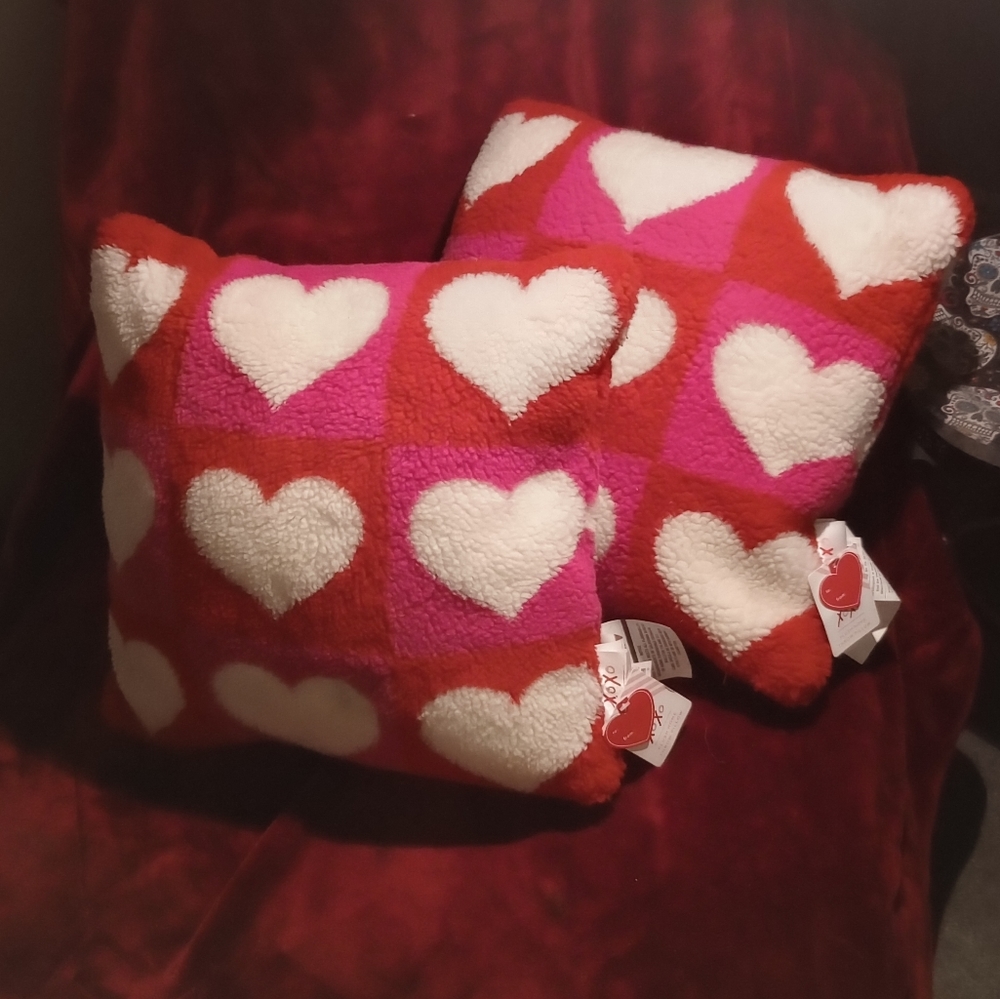Set of pink and red heart pattern throw pillows
